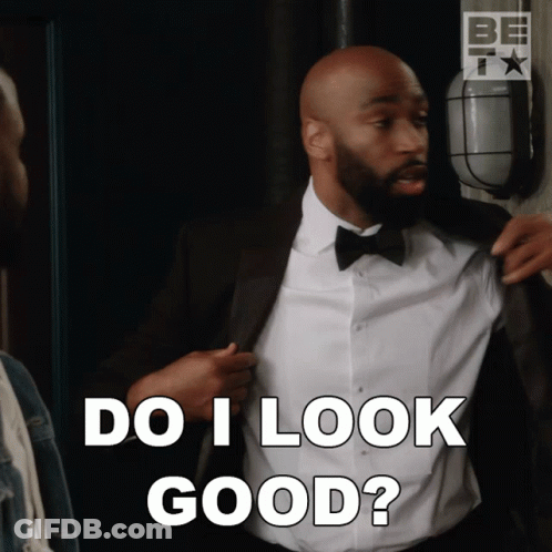 Man In Tuxedo And Bow Tie Says Do I Look Good GIF