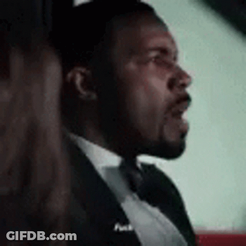 Man In Tuxedo And Bow Tie Sitting In Car With Woman GIF