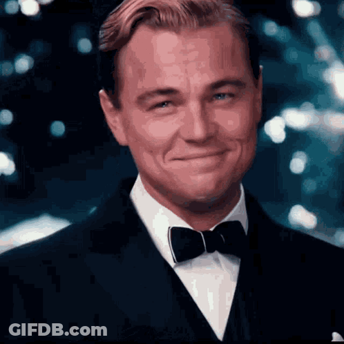 Man In Tuxedo And Bow Tie Smiling GIF