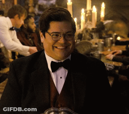 Man In Tuxedo And Bow Tie Smiling GIF