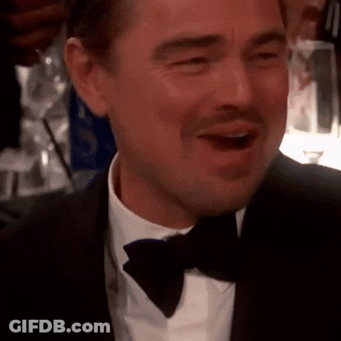 Man In Tuxedo And Bow Tie Smiling With Mouth Wide Open GIF