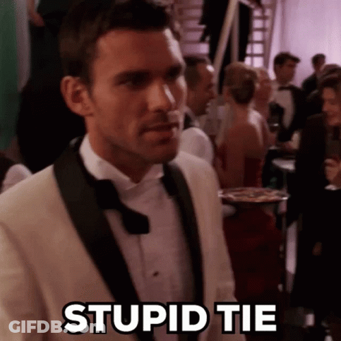 Man In Tuxedo And Bow Tie Standing GIF