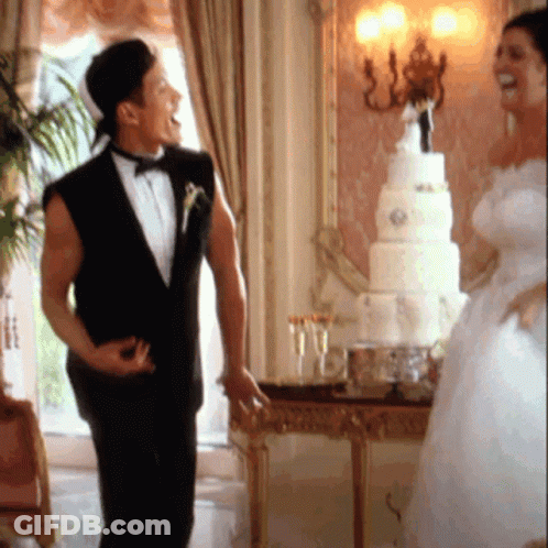 Man In Tuxedo And Bride In White Dress GIF