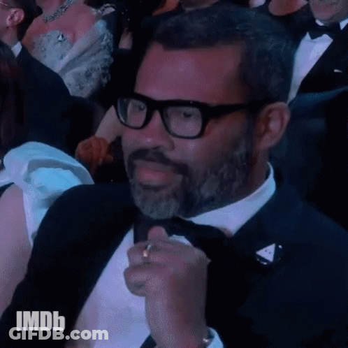 Man In Tuxedo And Glasses With IMDb GIF