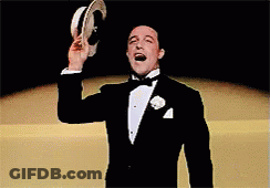 Man In Tuxedo And Hat Pointing And Smiling GIF