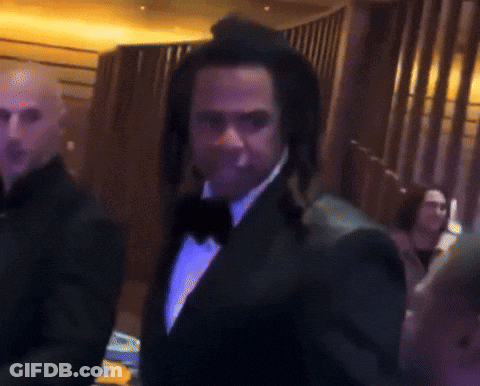 Man In Tuxedo And Hat Standing GIF