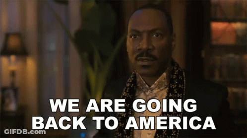 Man In Tuxedo And Scarf Says We Are Going Back To America GIF