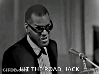 Man In Tuxedo And Sunglasses At Microphone GIF