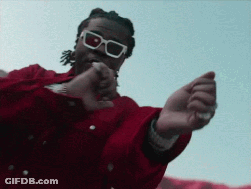 Man In Tuxedo And Sunglasses Hand On Stomach GIF