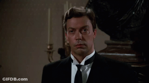 Man In Tuxedo And Tie Looking At Camera GIF