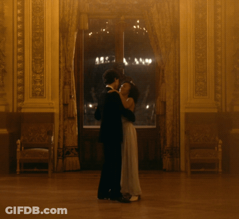 Man In Tuxedo And Woman Dancing GIF
