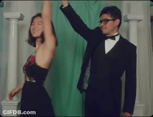 Man In Tuxedo And Woman Dancing GIF