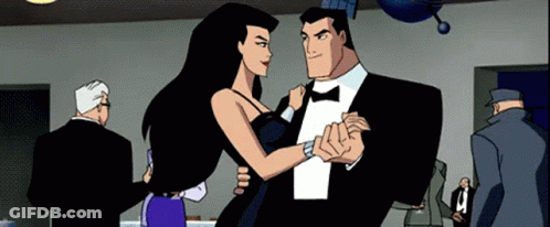 Man In Tuxedo And Woman In Dress Dancing GIF