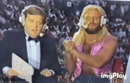 Man In Tuxedo And Woman In Pink Dress Sitting Together GIF