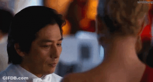 Man In Tuxedo And Woman In Red Dress GIF