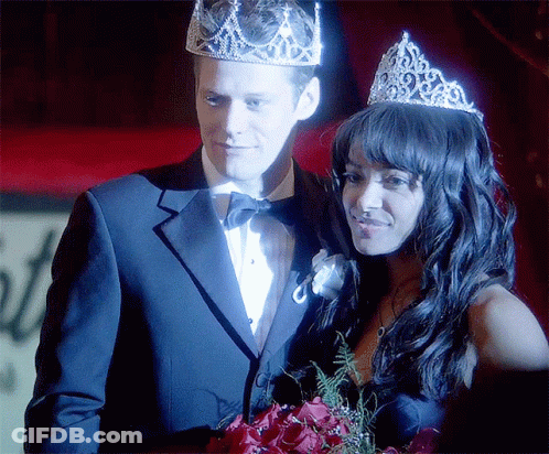 Man In Tuxedo And Woman In Tiara GIF