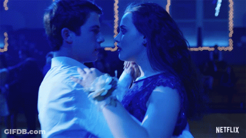 Man In Tuxedo And Woman In White Dress Dancing GIF