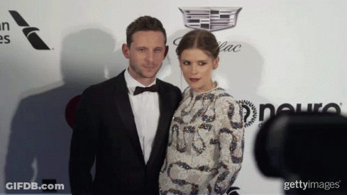 Man In Tuxedo And Woman In White Dress GIF