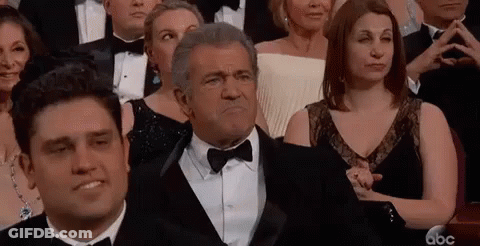 Man In Tuxedo At Awards Ceremony GIF