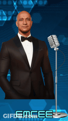 Man In Tuxedo At Microphone Saying Emcee GIF