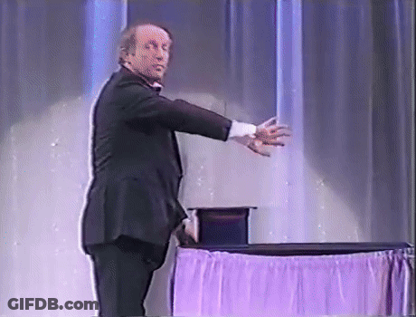 Man In Tuxedo At Purple Tablecloth GIF