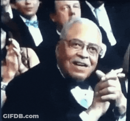 Man In Tuxedo Clapping In Crowd GIF