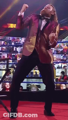 Man In Tuxedo Dancing On Red Carpet GIF