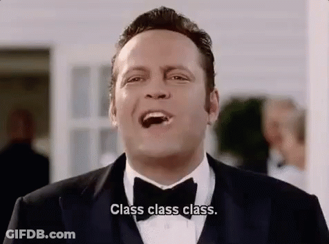 Man In Tuxedo Eating Chocolate GIF