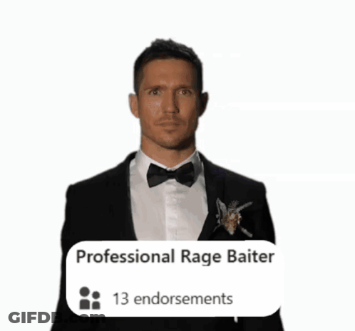 Man In Tuxedo Flexing Muscles In Front Of Professional Rage Baiter Banner GIF