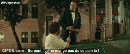 Man In Tuxedo Giving Lollipop GIF