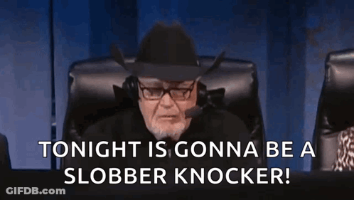Man In Tuxedo Holding Balloons In Front Of Crowd GIF
