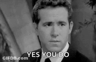 Man In Tuxedo Holding Bell Like A Butler GIF