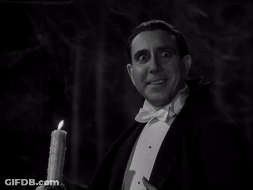 Man In Tuxedo Holding Candle GIF