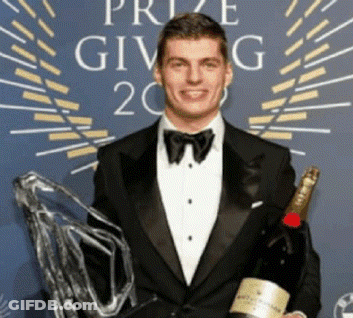 Man In Tuxedo Holding Champagne GIF