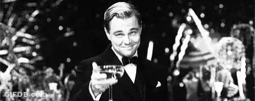 Man In Tuxedo Holding Champagne GIF