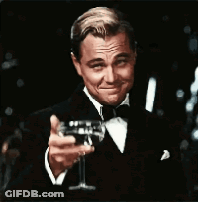 Man In Tuxedo Holding Champagne GIF
