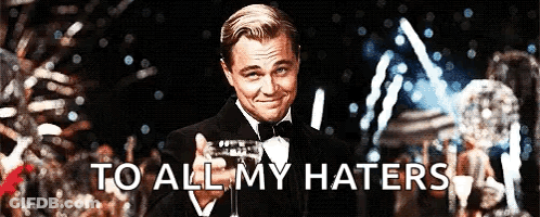 Man In Tuxedo Holding Champagne To All My Haters GIF