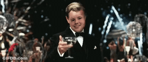 Man In Tuxedo Holding Champagne GIF