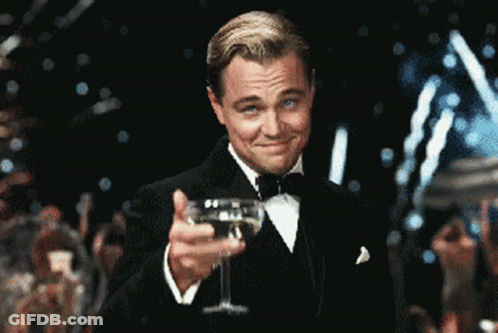 Man In Tuxedo Holding Champagne GIF