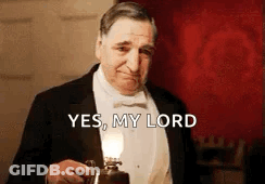 Man In Tuxedo Holding Lamp Saying Yes My Lord GIF