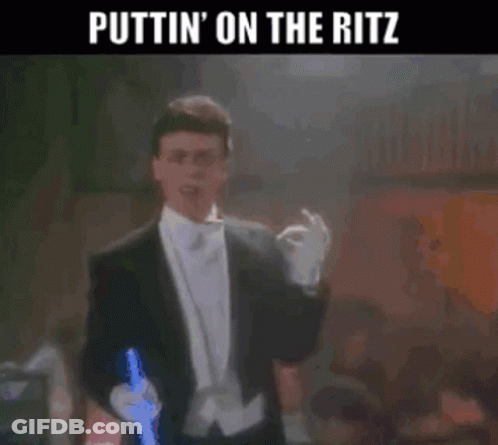 Man In Tuxedo Holding Lightsaber Puttin On The Ritz GIF