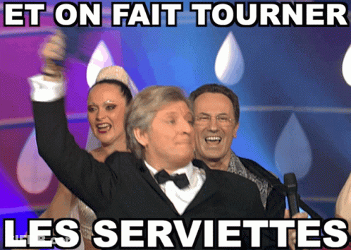Man In Tuxedo Holding Microphone Et On Fait Tourner Les Serviettes GIF