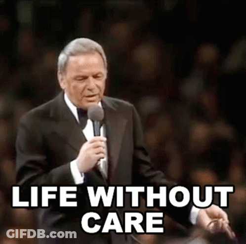 Man In Tuxedo Holding Microphone With Life Without Care GIF