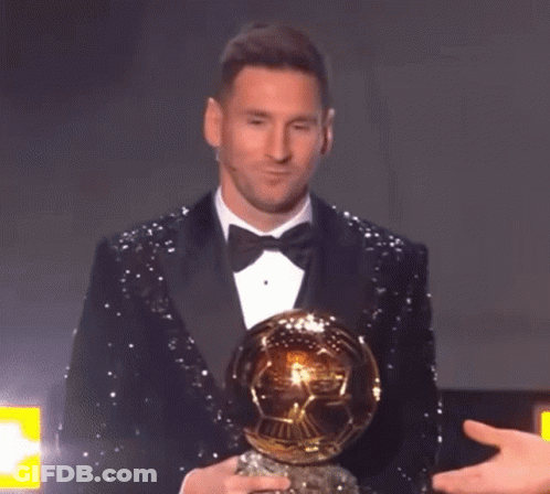 Man In Tuxedo Holding Soccer Ball GIF