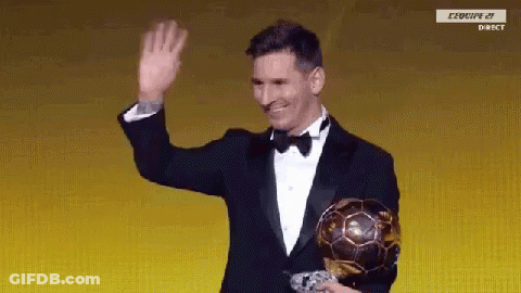 Man In Tuxedo Holding Soccer Ball And Waving GIF