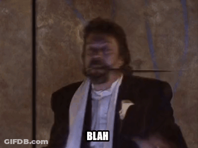 Man In Tuxedo Holding Sword In Mouth Saying Blah GIF