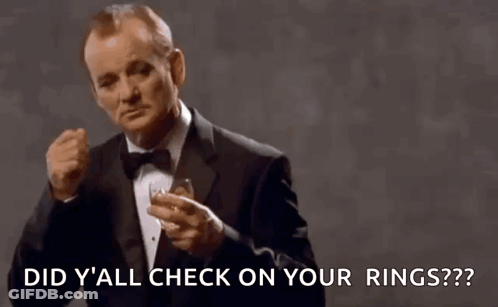 Man In Tuxedo Holding Whiskey Ring A Ding GIF