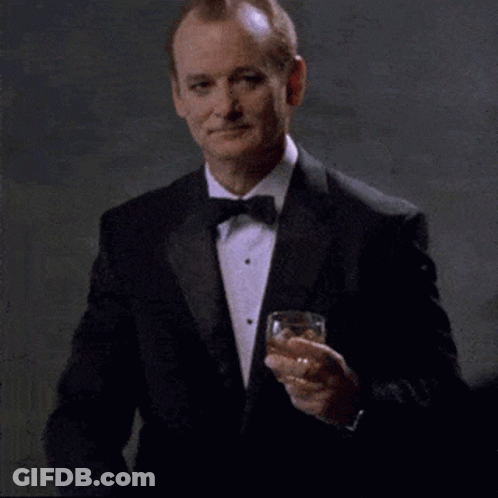 Man In Tuxedo Holding Whiskey GIF