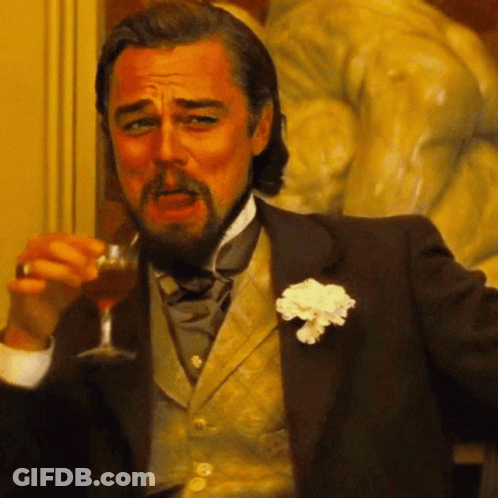 Man In Tuxedo Holding Wine GIF