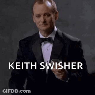 Man In Tuxedo Holding Wine Glass GIF